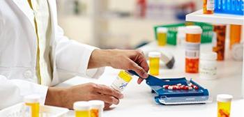 Pharmacy technician prepares prescription